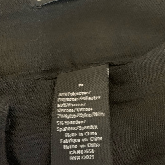 Black dressy skirt with belt loops. Small slit in back - Picture 4 of 5